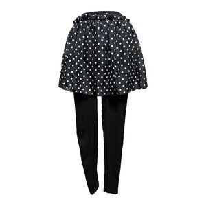 Short black and white polka dotted skirt with attached black leggings
